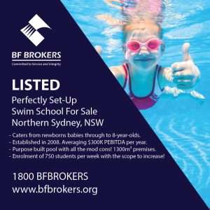 girl swimming underwater with thumbs up